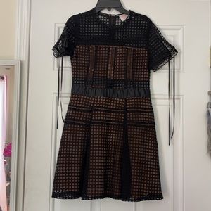 Short tulle and sheer dotted black dress